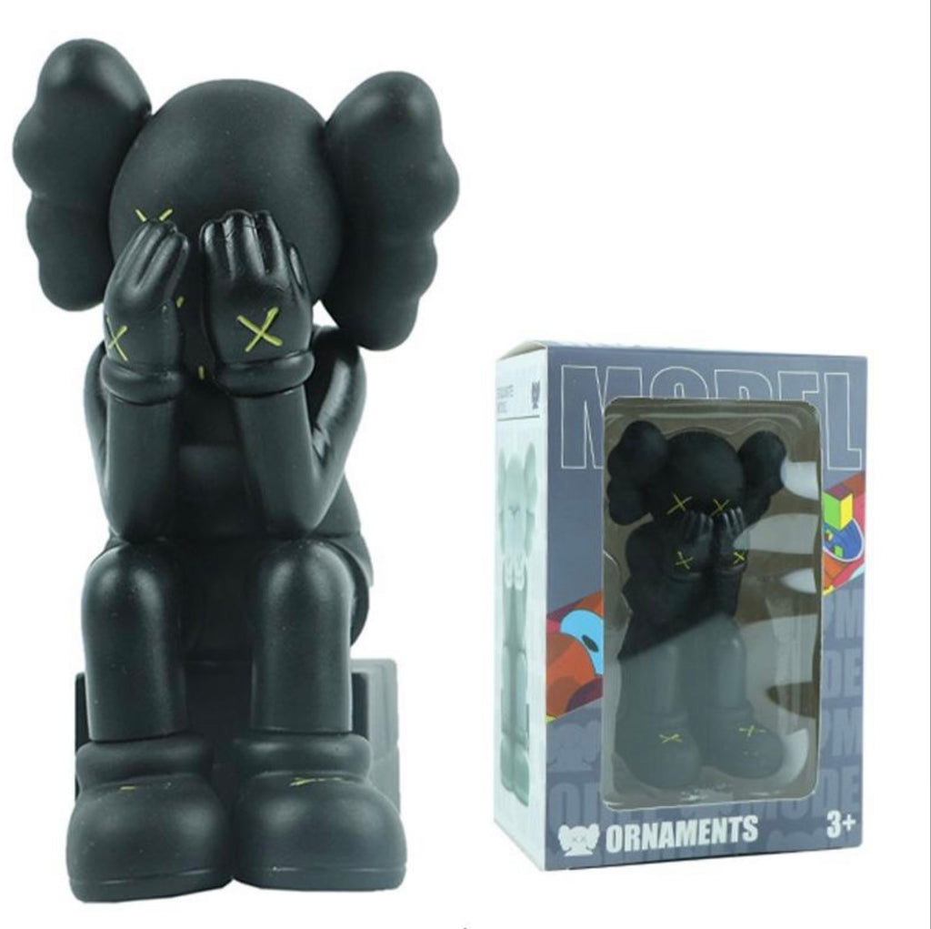 Black mini KAWS figure